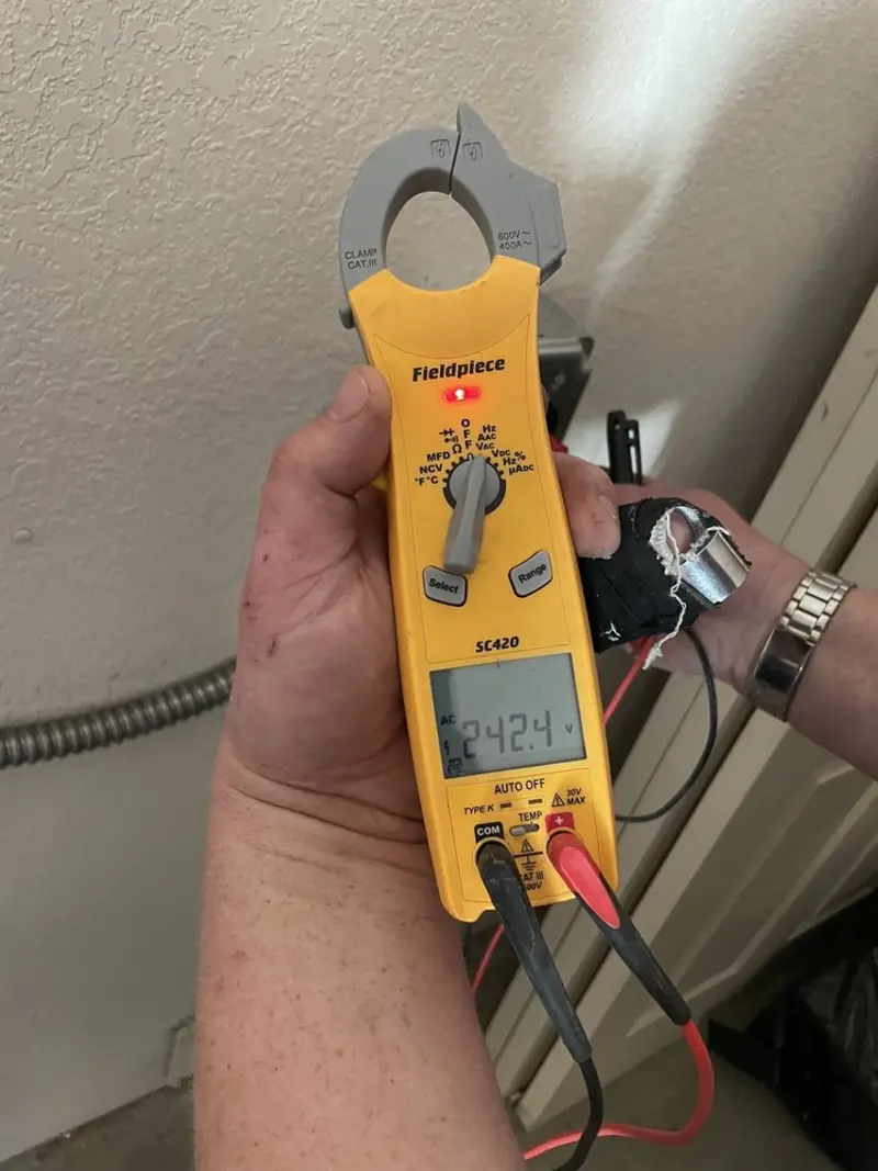 Voltage testing with clamp meter during Circuit Breaker Repair in Poulsbo